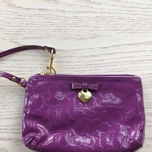 rare discontinued coach purple wristlet